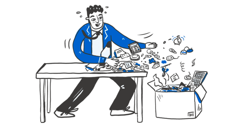 A man sweeping clutter into a box